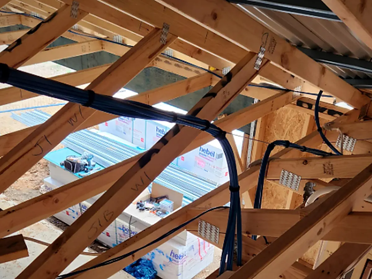 Low-voltage bundles fanned out to device locations through open framing