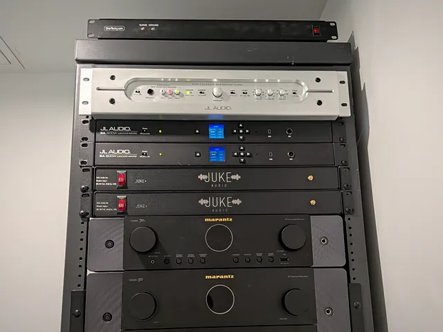 Rack-mounted audio distribution amplifiers for a whole-property system